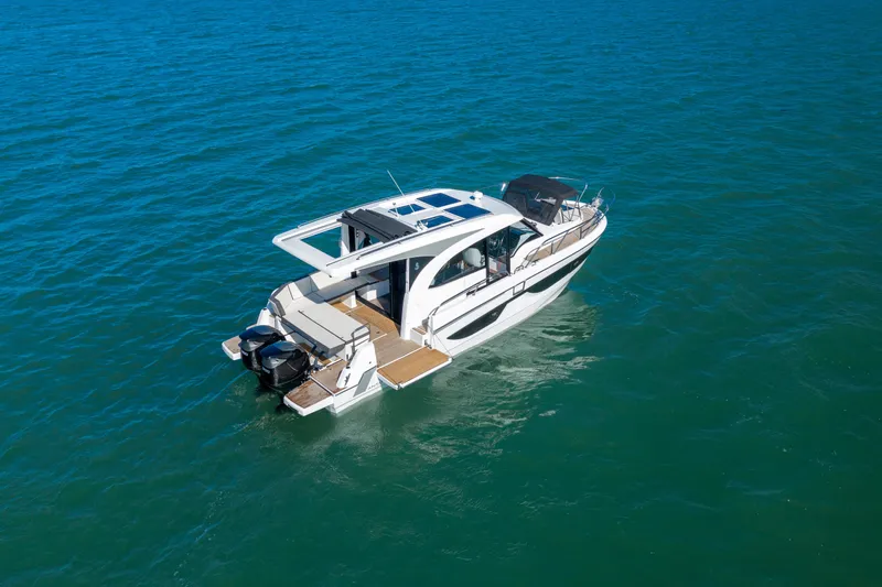  Yacht Photos Pics 2026 Beneteau Antares 11 Coupe cruising on open water, showcasing sleek design and modern features.