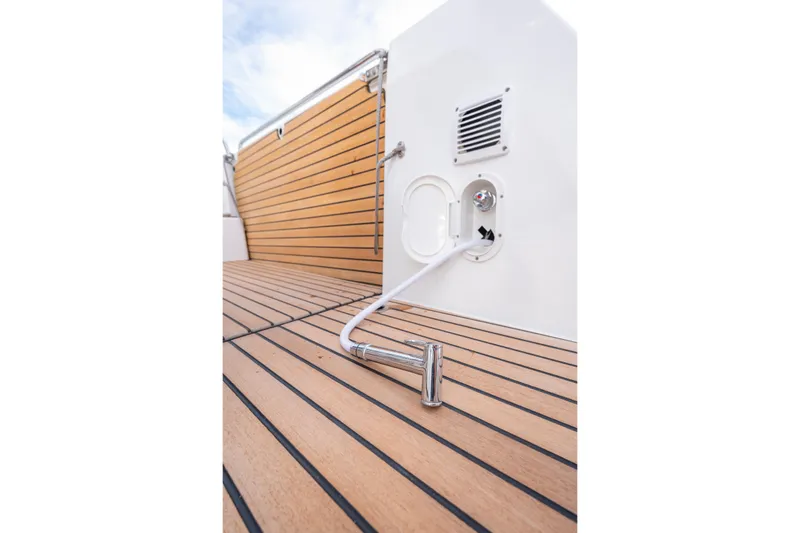  Yacht Photos Pics 2026 Beneteau Antares 11 Coupe deck with wood finish and water hose.