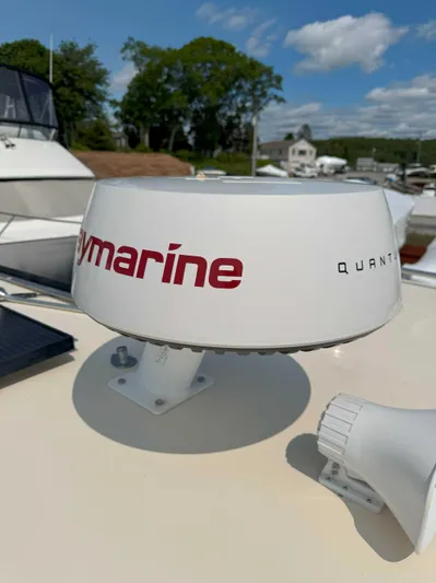 Fetch Yacht Photos Pics Raymarine radar on 2004 Mainship Pilot 34 boat under clear sky.
