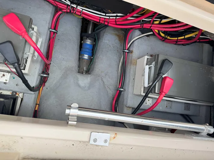 Fetch Yacht Photos Pics 2004 Mainship Pilot 34 engine compartment with wiring and battery connections.