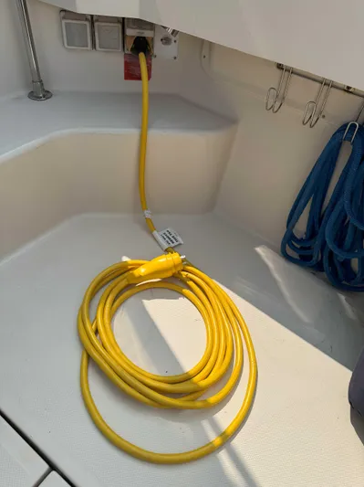 Fetch Yacht Photos Pics Yellow power cable on 2004 Mainship Pilot 34 boat deck.
