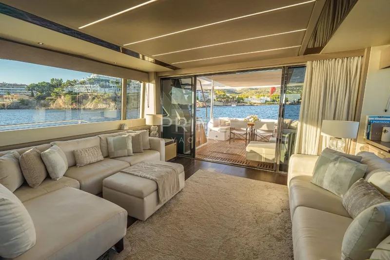 Lady M Yacht Photos Pics Luxurious interior of 2019 Sunseeker 76 Yacht with elegant seating and scenic ocean view.