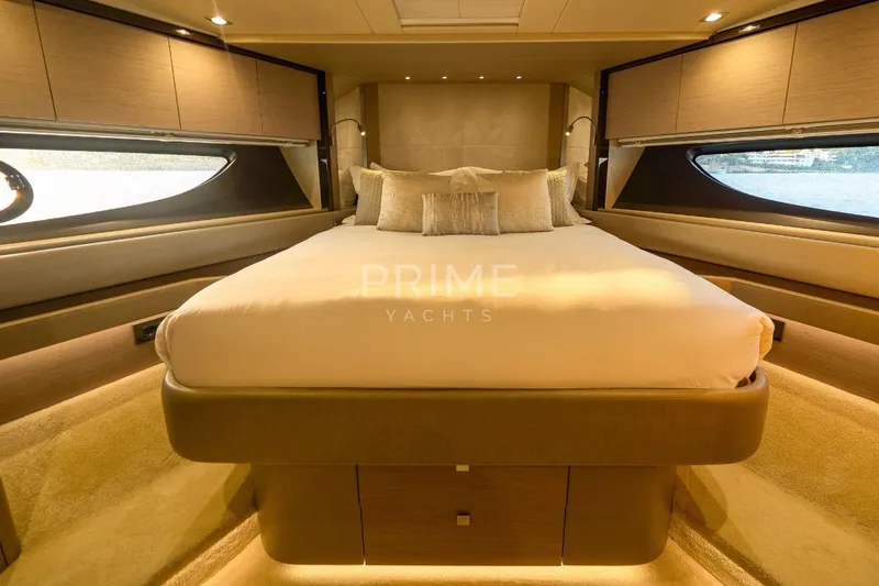 Lady M Yacht Photos Pics Luxurious bedroom interior of 2019 Sunseeker 76 Yacht with elegant design and large windows.