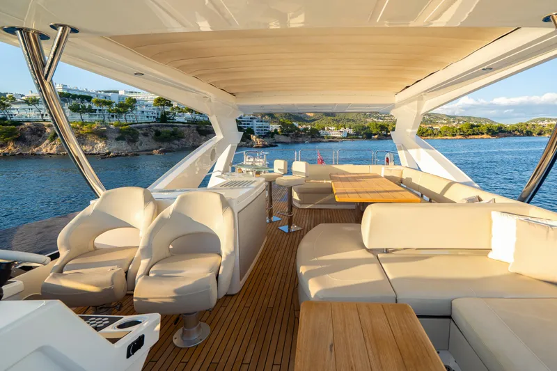 Lady M Yacht Photos Pics Luxurious 2019 Sunseeker 76 Yacht interior with elegant seating and scenic ocean view.