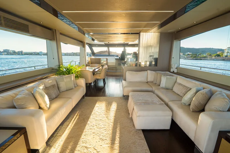 Lady M Yacht Photos Pics Luxurious interior of 2019 Sunseeker 76 Yacht with elegant seating and panoramic windows.
