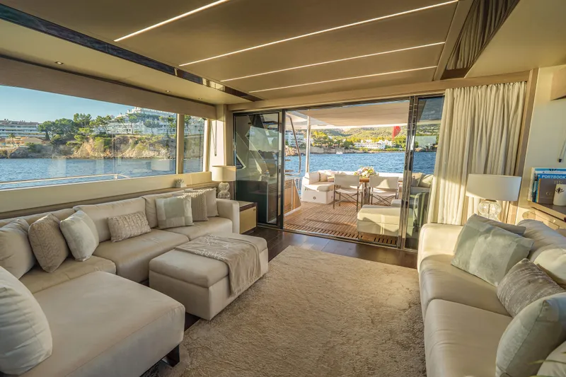 Lady M Yacht Photos Pics Luxurious interior of 2019 Sunseeker 76 Yacht with elegant seating and scenic ocean view.