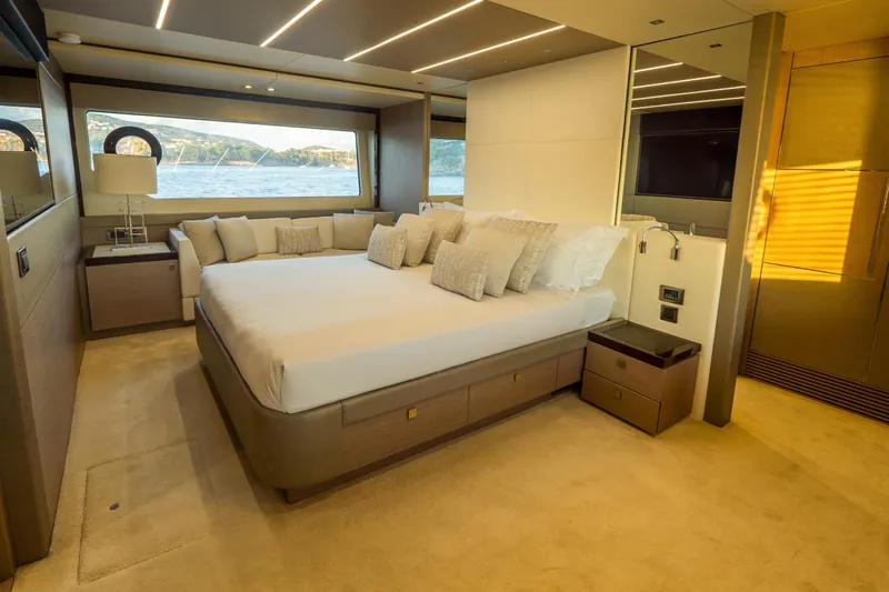 Lady M Yacht Photos Pics Luxurious bedroom interior of 2019 Sunseeker 76 Yacht with scenic ocean view.