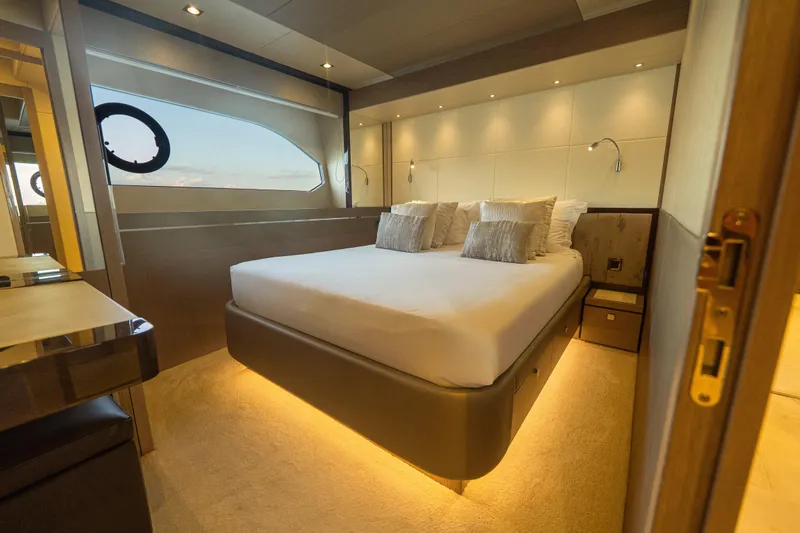 Lady M Yacht Photos Pics Luxurious bedroom interior of 2019 Sunseeker 76 Yacht with modern design and ambient lighting.