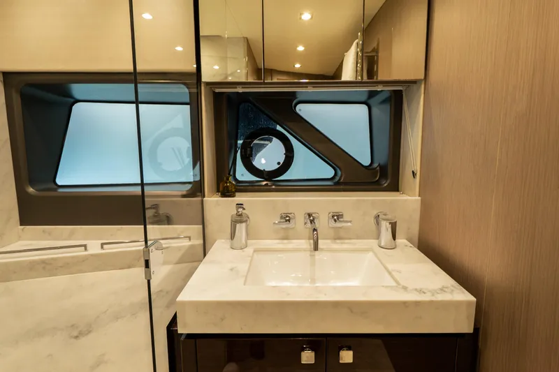 Lady M Yacht Photos Pics Luxurious bathroom interior of 2019 Sunseeker 76 Yacht with modern fixtures and elegant design.