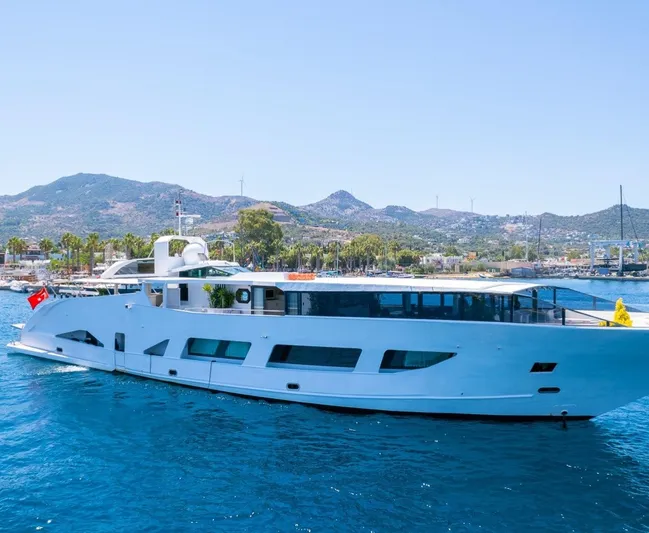  Yacht Photos Pics Luxurious custom yacht "42" from 1983 cruising in scenic coastal waters.