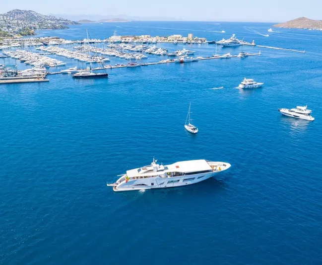  Yacht Photos Pics Aerial view of luxury yachts in a vibrant blue marina, Custom 42 model, 1983.