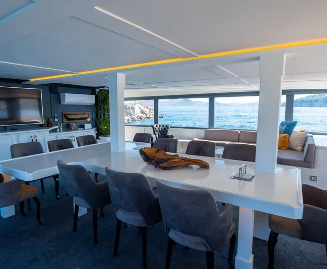  Yacht Photos Pics Luxurious yacht interior with dining area, ocean view, and modern decor, Custom model 42, 1983.