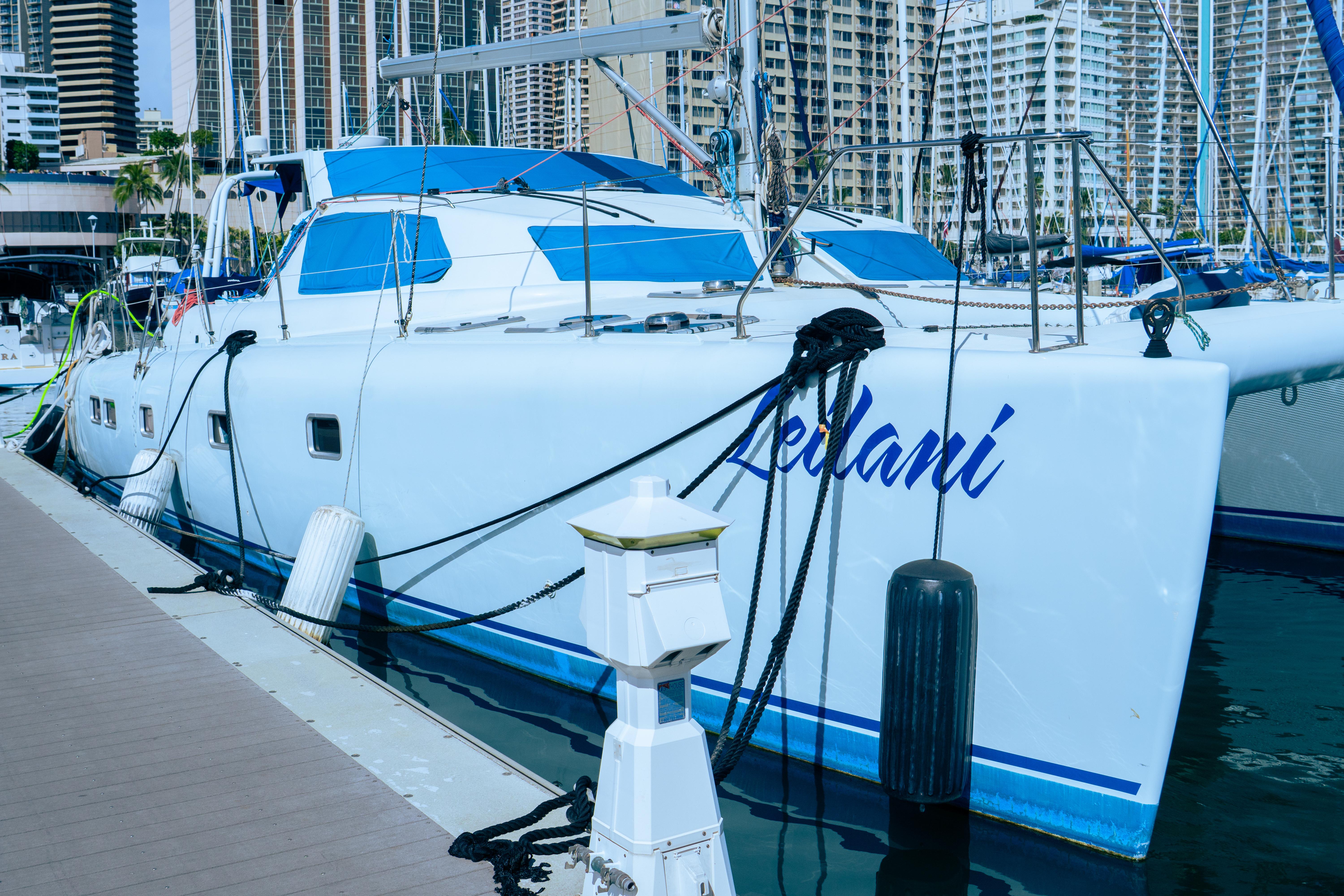 Luxury performance catamaran docked in marina, 2005 custom model, named "Leilani".