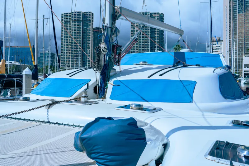 Leilani Yacht Photos Pics Luxury performance yacht docked in marina, city skyline in background, 2005 model.