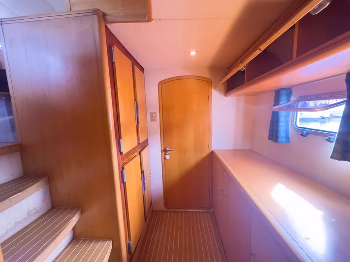 Leilani Yacht Photos Pics Luxurious 2005 custom yacht interior with wooden cabinetry and natural light.