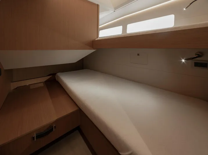  Yacht Photos Pics 2022 Jeanneau Yacht 60 cabin interior with modern wood finish and ambient lighting.
