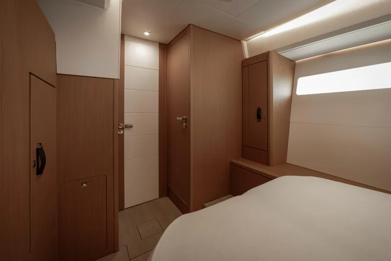  Yacht Photos Pics Luxurious interior of 2022 Jeanneau Yacht 60, featuring elegant wood finishes and modern design.