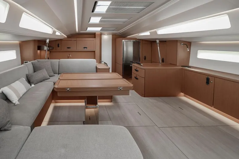  Yacht Photos Pics Luxurious interior of 2022 Jeanneau Yacht 60 with modern furnishings and ample natural light.