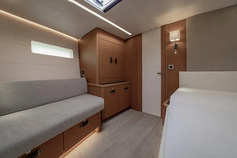  Yacht Photos Pics Luxurious interior of 2022 Jeanneau Yacht 60 with modern furnishings and ambient lighting.