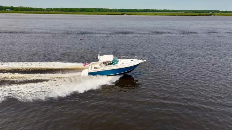 Big Time Yacht Photos Pics 1996 Tiara Yachts 3500 Express cruising swiftly on the water.