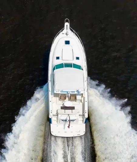 Big Time Yacht Photos Pics Aerial view of 1996 Tiara Yachts 3500 Express cruising on water.