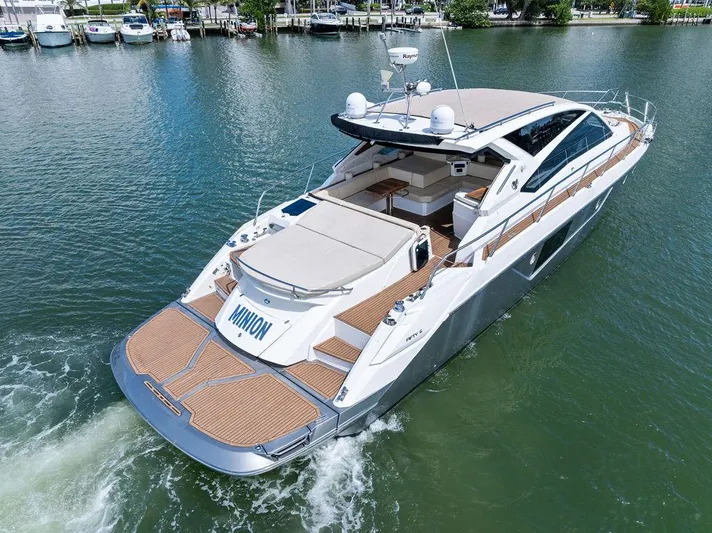 Minion Yacht Photos Pics Luxury 2014 Cranchi 56 HT yacht cruising on a serene lake.