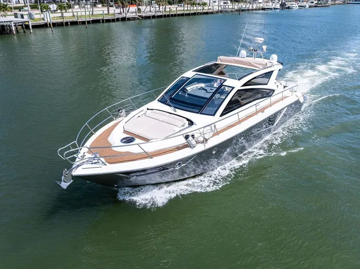 Minion Yacht Photos Pics 2014 Cranchi 56 HT yacht cruising on a calm waterway.