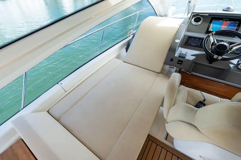 Minion Yacht Photos Pics Luxurious interior of 2014 Cranchi 56 HT yacht with plush seating and modern dashboard.