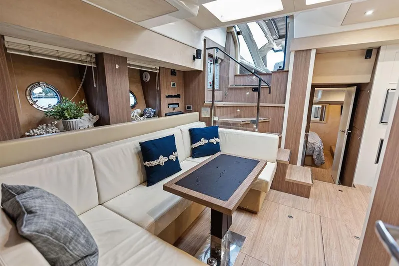 Minion Yacht Photos Pics Luxurious interior of 2014 Cranchi 56 HT yacht with elegant seating and modern design.