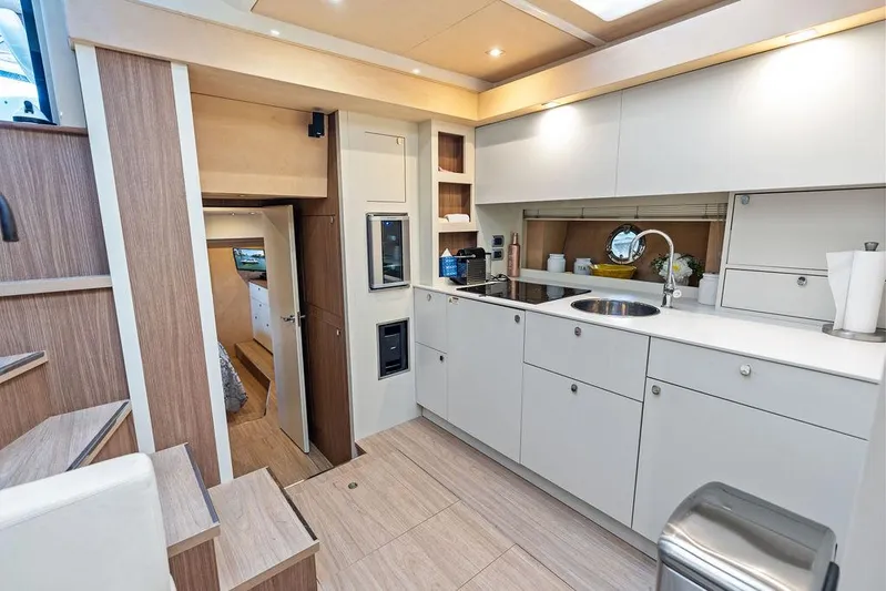 Minion Yacht Photos Pics Luxurious 2014 Cranchi 56 HT yacht interior with modern kitchen and sleek cabinetry.
