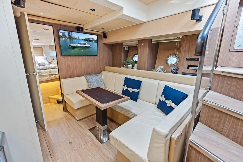 Minion Yacht Photos Pics Luxurious interior of 2014 Cranchi 56 HT yacht with elegant seating and modern decor.