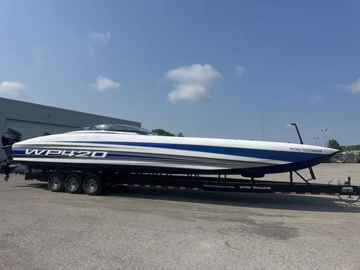  Yacht Photos Pics 2018 Wright Performance 420 boat on trailer, parked outdoors under clear sky.