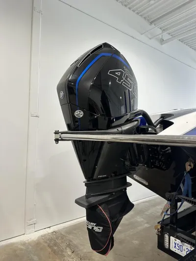  Yacht Photos Pics 2018 Wright Performance 420 boat engine, black with blue accents, in a garage setting.