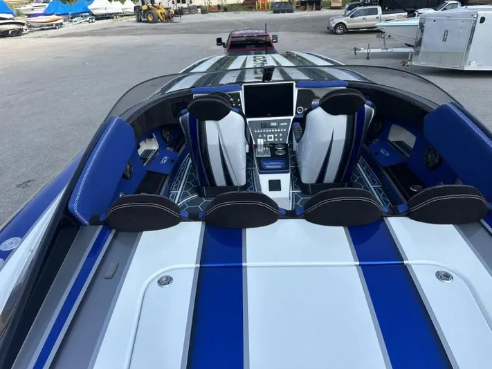  Yacht Photos Pics 2018 Wright Performance 420 boat interior with blue and white seating and advanced dashboard controls.