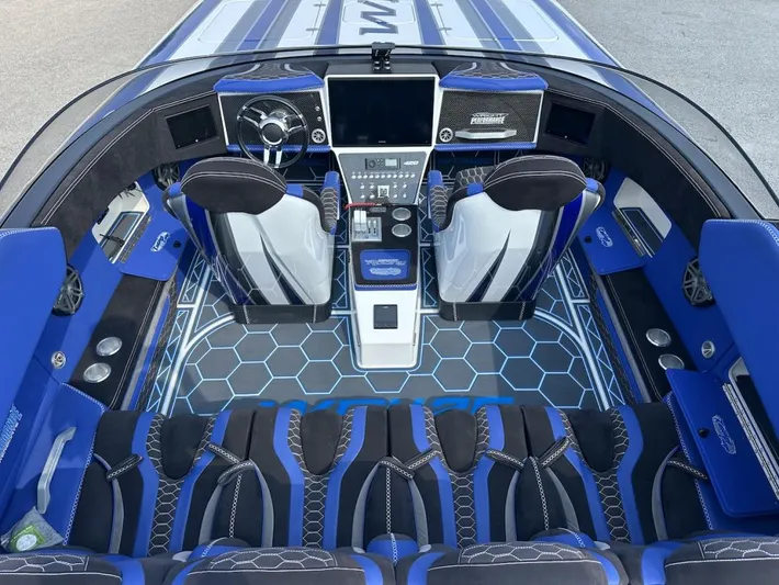  Yacht Photos Pics Interior of 2018 Wright Performance 420 boat with blue and black seating and hexagonal floor design.