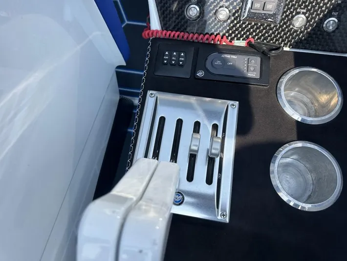  Yacht Photos Pics Control panel of 2018 Wright Performance 420 boat with throttle levers and cup holders.