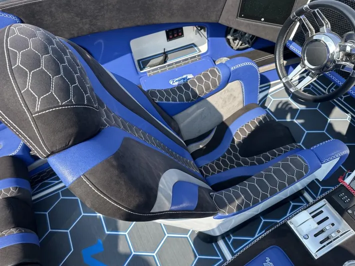 Yacht Photos Pics Interior of 2018 Wright Performance 420 boat with blue and black hexagonal-patterned seats.