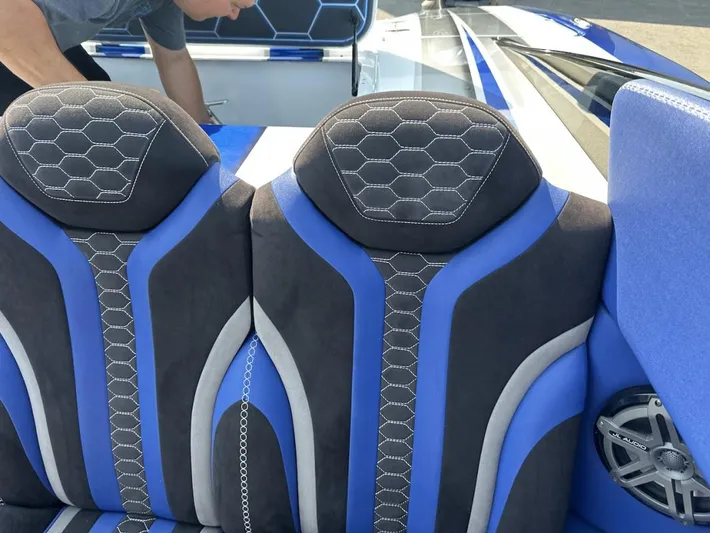  Yacht Photos Pics Blue and black seats in a 2018 Wright Performance 420 boat interior.