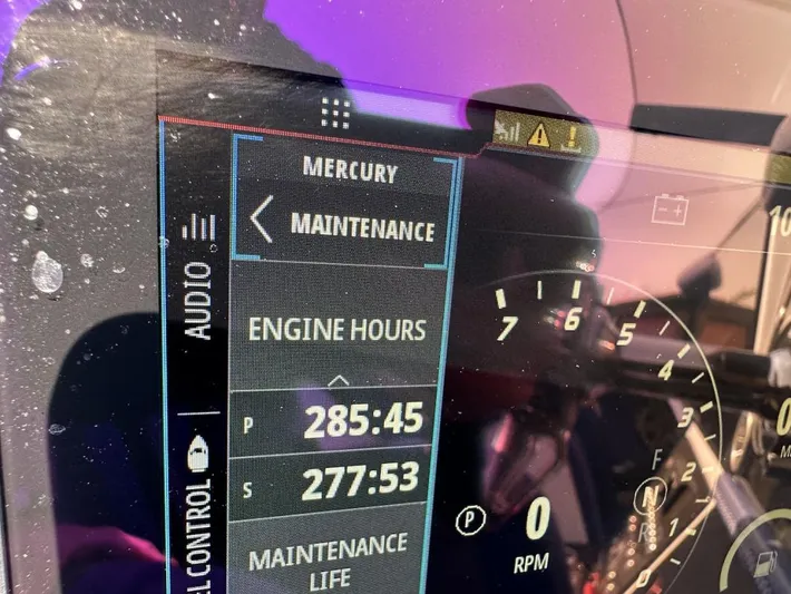  Yacht Photos Pics Close-up of a 2018 Wright Performance 420 dashboard showing engine hours and maintenance alerts.