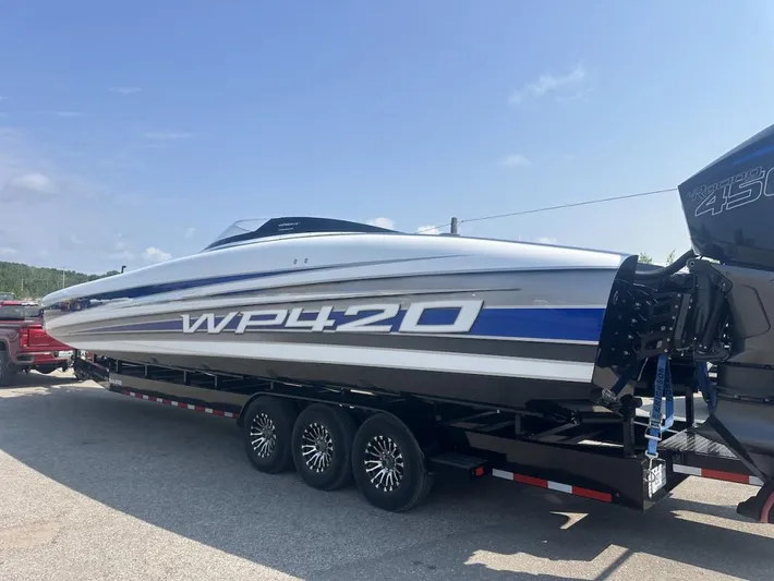  Yacht Photos Pics 2018 Wright Performance 420 boat on trailer, sleek design, blue and white accents.