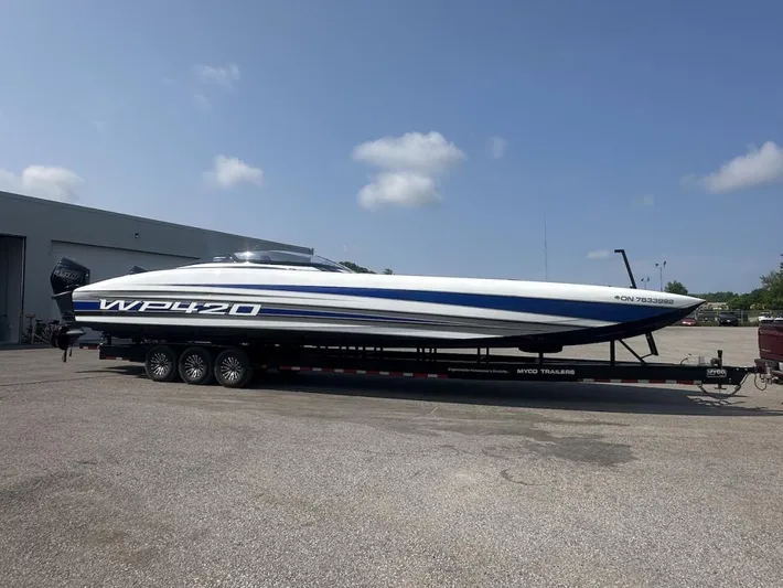  Yacht Photos Pics 2018 Wright Performance 420 boat on trailer, parked outdoors under a clear sky.