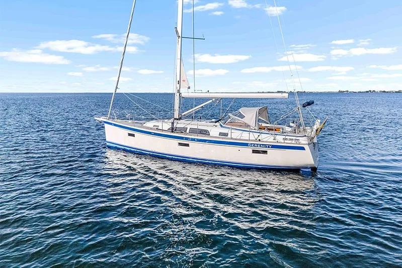  Yacht Photos Pics 2022 Hallberg-Rassy 400 sailboat named "Serenity" cruising on open water.