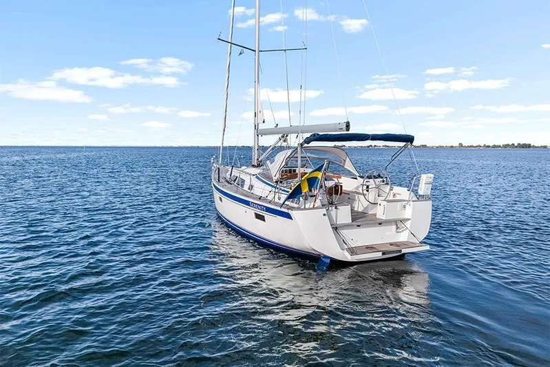  Yacht Photos Pics 2022 Hallberg-Rassy 400 sailboat on open water, clear sky background.
