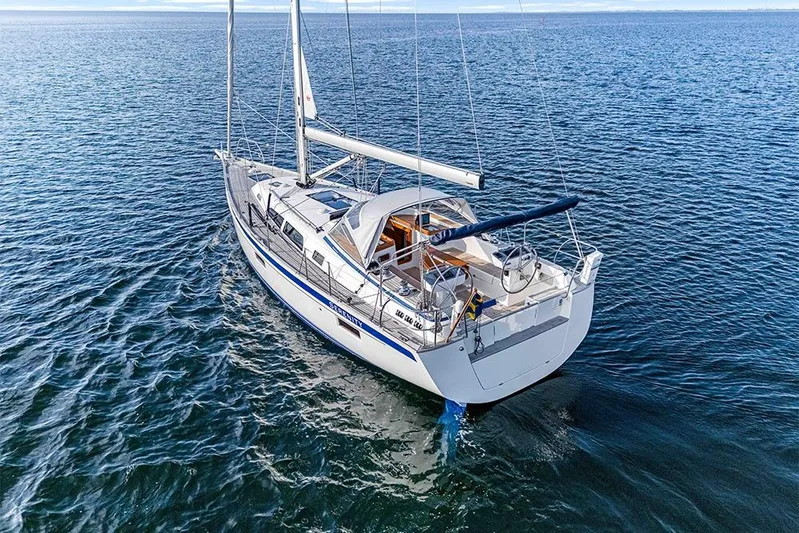  Yacht Photos Pics 2022 Hallberg-Rassy 400 sailboat cruising on open water, showcasing elegant design.