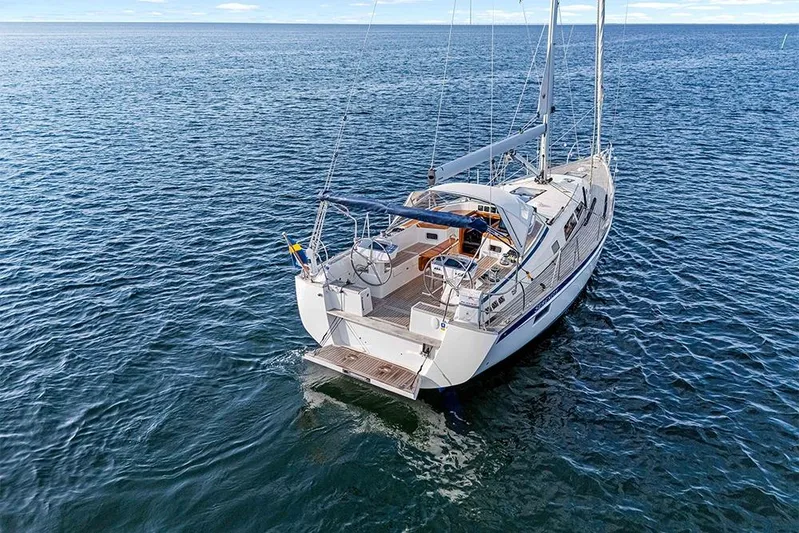  Yacht Photos Pics 2022 Hallberg-Rassy 400 sailboat on open water, showcasing sleek design and craftsmanship.