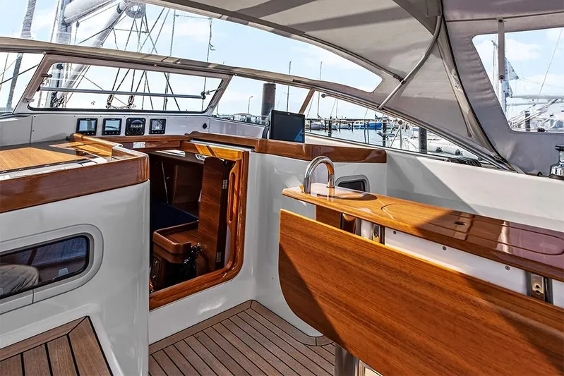  Yacht Photos Pics 2022 Hallberg-Rassy 400 yacht interior with sleek wood finish and modern design.