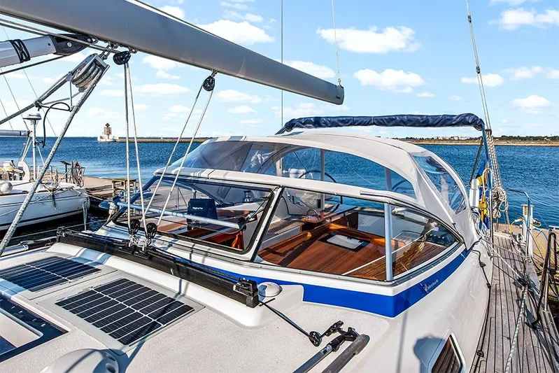  Yacht Photos Pics 2022 Hallberg-Rassy 400 yacht docked, featuring sleek design and solar panels.