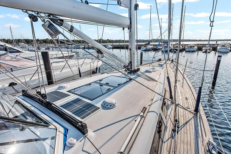  Yacht Photos Pics 2022 Hallberg-Rassy 400 sailboat docked at a marina, showcasing deck and rigging.