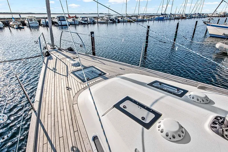  Yacht Photos Pics Deck of 2022 Hallberg-Rassy 400 yacht in marina, showcasing sleek design and craftsmanship.