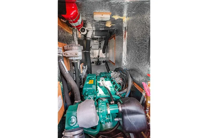  Yacht Photos Pics Engine room of 2022 Hallberg-Rassy 400 yacht with visible machinery and equipment.